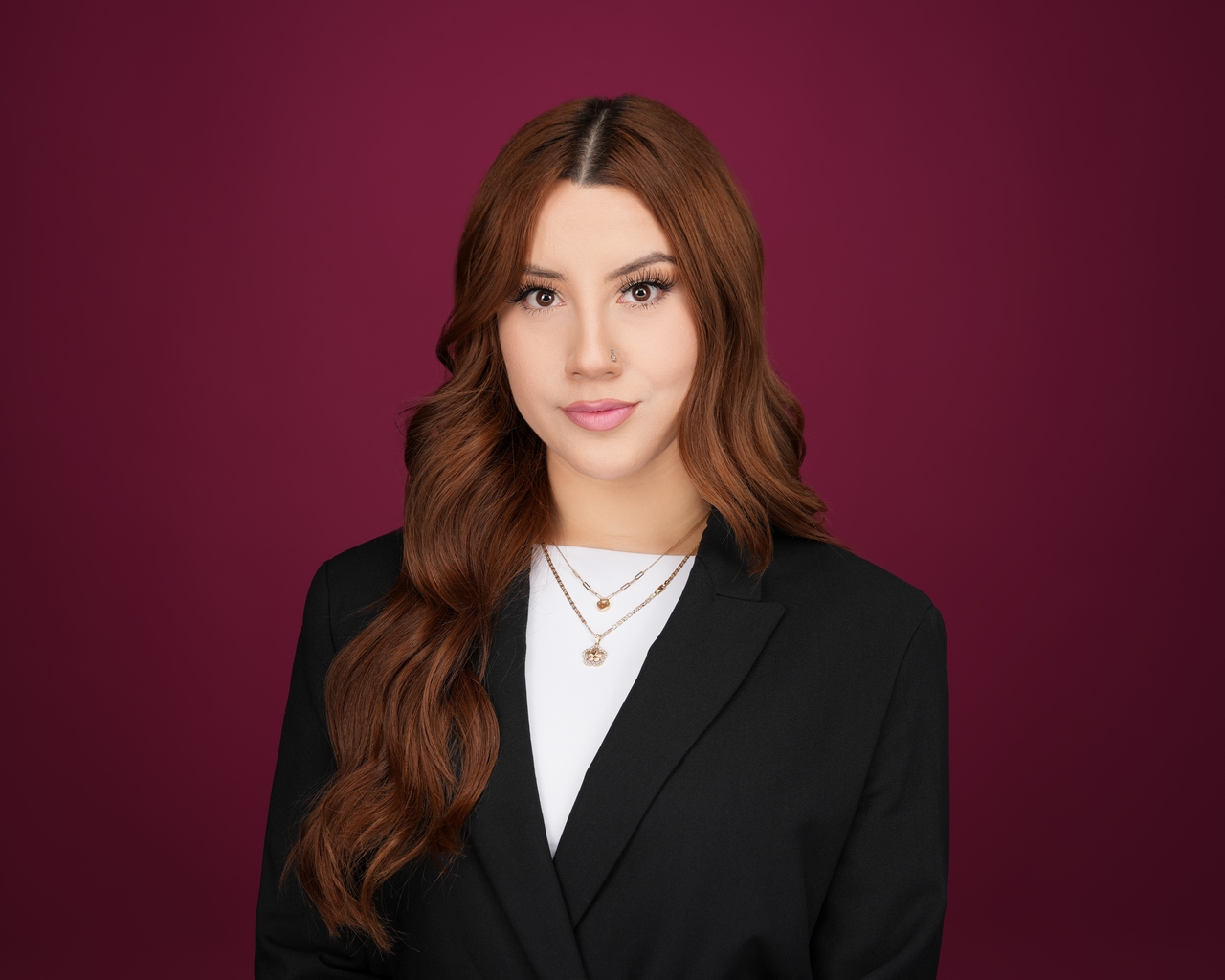 Professional headshot wardrobe with clean neckline and structured layers