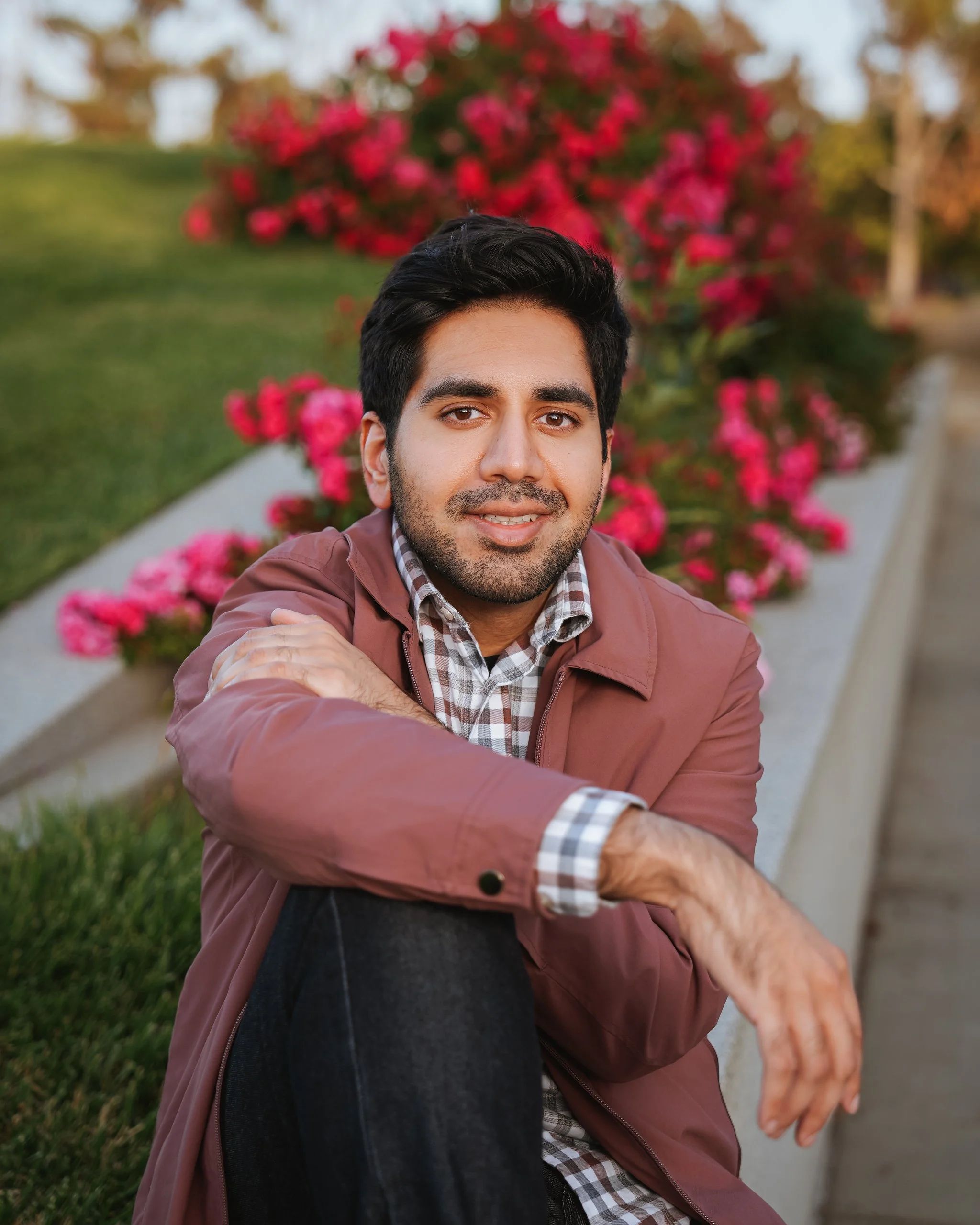 Dating portrait of a man seated outdoors at Santa Clara Square in California